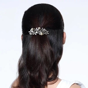 Minimalist silver hair clip with rhinestones and pearls on model back view