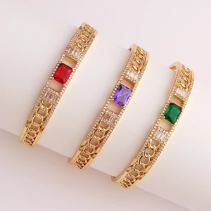 Three gold-plated chain bracelets featuring colorful square zircon stones on display