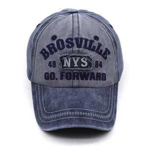 Detail of embroidered Brosville logo on vintage washed cotton dark blue baseball cap