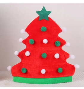Close-up of red Christmas tree hat with plush balls and green star topper for party