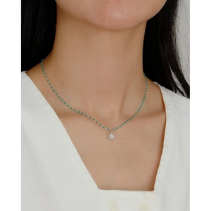 S925 sterling silver shell pendant necklace with pearls and blue beads on a model