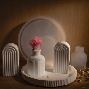 Detail of DIY silicone molds for striped tray, vase, and arched resin ornaments