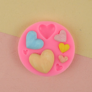 Pink silicone mold for heart fondant cakes and DIY chocolates with various size cavities