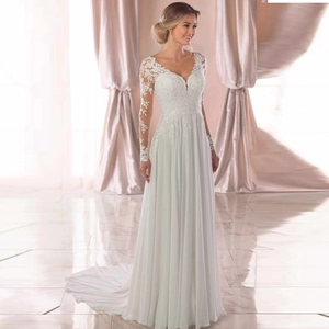 Elegant ivory long sleeve lace wedding dress with deep V-neck and flowing tulle train