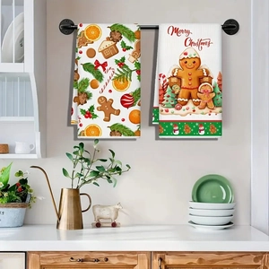 Detail of Christmas microfiber kitchen towels featuring gingerbread and holiday prints