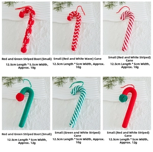 Detail of knitted Christmas tree ornaments showing wool boots and candy canes dimensions