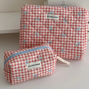 Red plaid quilted makeup bag set with blue bow patterns and light blue zippers