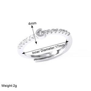 Detailed view of silver adjustable ring with letter G and size measurements