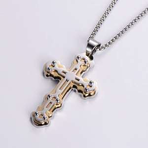 Three-layer cross pendant necklace in gold and silver tones with metallic chain