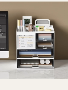 Detail of white desktop organizer with transparent drawers and magnetic dry-erase board