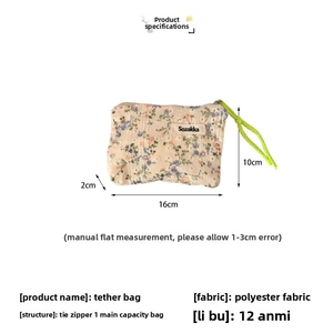 Detail view of small floral polyester cosmetic pouch with 16x10x2cm size specifications