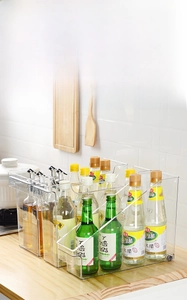 Macro detail of a narrow transparent kitchen organizer box for countertop storage