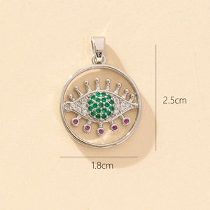 Detail shot of evil eye pendant with green and pink zircons showing 2.5cm height dimension