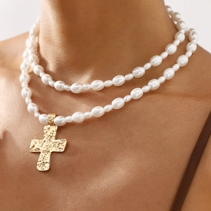 French vintage double layer pearl necklace featuring a hammered gold cross pendant