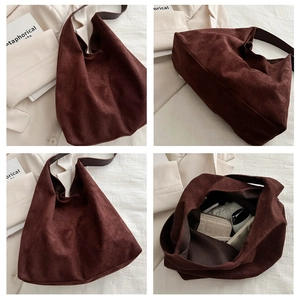 Macro view of large dark brown suede Hobo bag showing spacious interior and texture