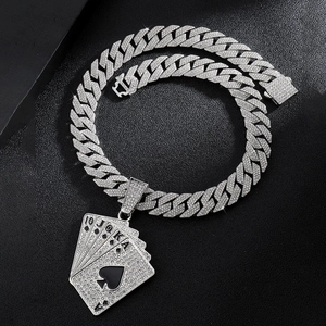Detail of silver iced out poker pendant with royal flush cuban chain and crystals