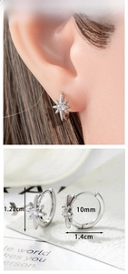 Detail view of starburst earring dimensions with 1.4cm width and polished silver finish