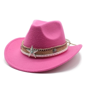 Detailed shot of pink felt cowboy hat with braided rope and turquoise star buckle ornament