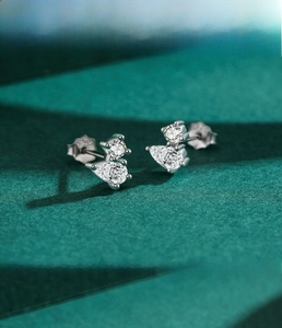 Macro detail of S925 silver waterdrop earrings with sparkling cubic zirconia stones