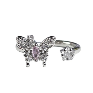 Silver butterfly and star open ring with pink gem and white zircons on white background