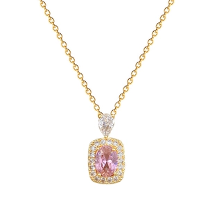 Luxurious gold necklace with pink oval gemstone and crystal pendant on white background