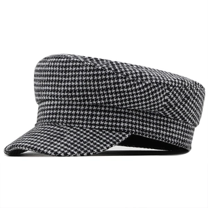 Classic black and white houndstooth baker boy hat for women with structured wool texture