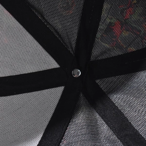 Detailed macro view of black mesh baseball cap interior with reinforced tape and rivet