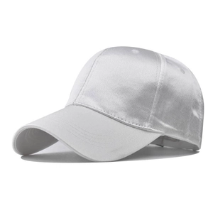 Close-up of silver satin baseball cap showing smooth texture and fine stitching detail