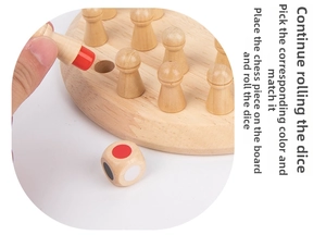 Macro view of hand placing colorful wooden memory chess pieces on a circular wooden game board