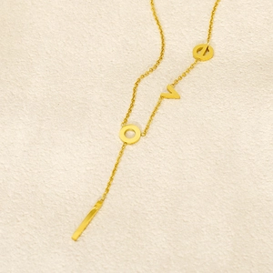 Golden stainless steel necklace featuring LOVE letters and a sleek vertical bar pendant