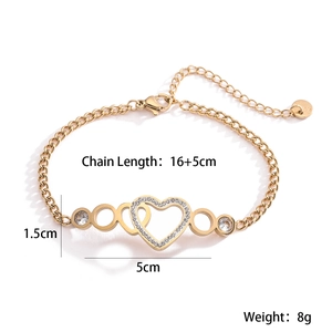 Macro detail of gold 18K plated stainless steel heart bracelet with zircon settings