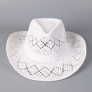 Close-up of white woven straw cowboy hat with intricate hollow diamond patterns