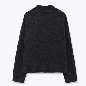 Oversized dark grey knit sweater with mock neck and ribbed cuffs in a flat lay view