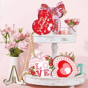 Three-piece Valentine's Day heart wooden ornaments set on white tray for desk decor