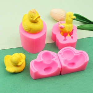Macro view of 3D little duck silicone molds for chocolate and handmade soap making