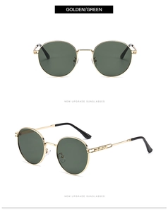 Detail view of round gold metal sunglasses with dark green lenses in dual perspective