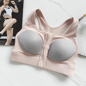 Close-up of pink sports bra with front zipper and honeycomb breathable pads detail