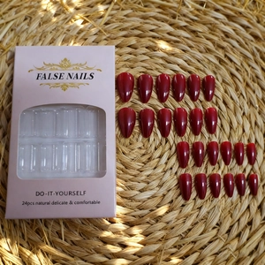 Glossy deep red almond press-on nails set with 24 pieces in minimalist packaging