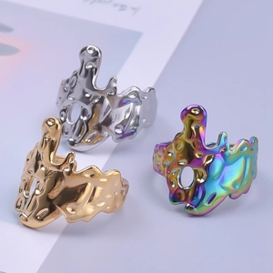 Irregular liquid metal texture rings in silver gold and rainbow colors on soft background
