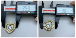 Detailed size measurement of gold heart pendant with micro-set rhinestones in millimeters