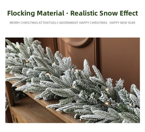 Detail of flocked Christmas garland with realistic snow effect and warm LED lights