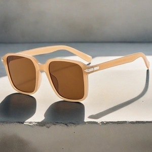 Detailed close-up of translucent champagne square frame sunglasses with tinted lenses