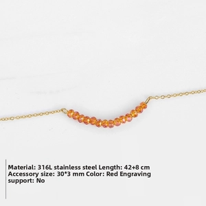 Detail view of 316L stainless steel gold necklace with faceted red bead bar pendant