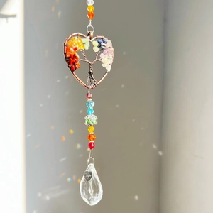 Detail of tree of life suncatcher with rainbow beads and heart made with love tag