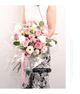 Detail of waterproof flower wrapping paper with pink border and decorative ribbon