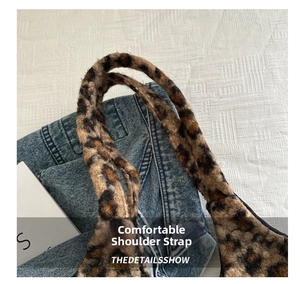 Detail of soft leopard print plush shoulder strap for a chic faux fur winter handbag