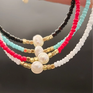Fashionable freshwater pearl necklace with colorful beads and gold metal accents