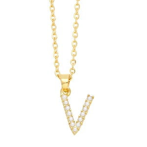 Detail view of a gold O-chain necklace featuring a V-shaped pendant with inlaid pearls