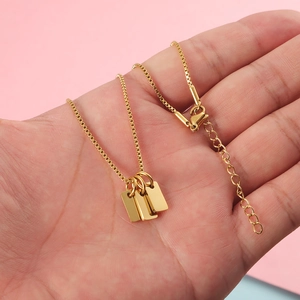 Gold stainless steel box chain necklace featuring three minimalist rectangular plate pendants