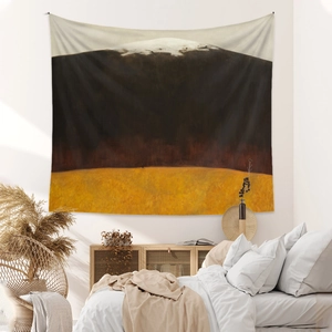 Detailed view of bohemian mountain tapestry hanging above a bed in a modern bedroom